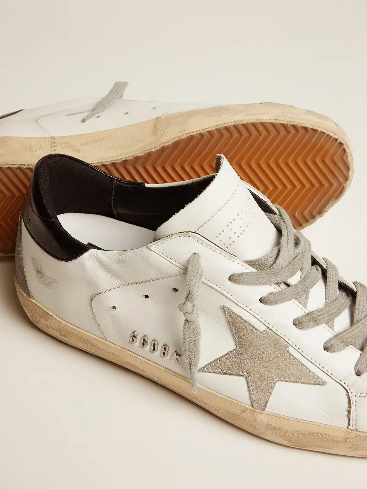Womens Super Star with black heel tab and metal stud lettering